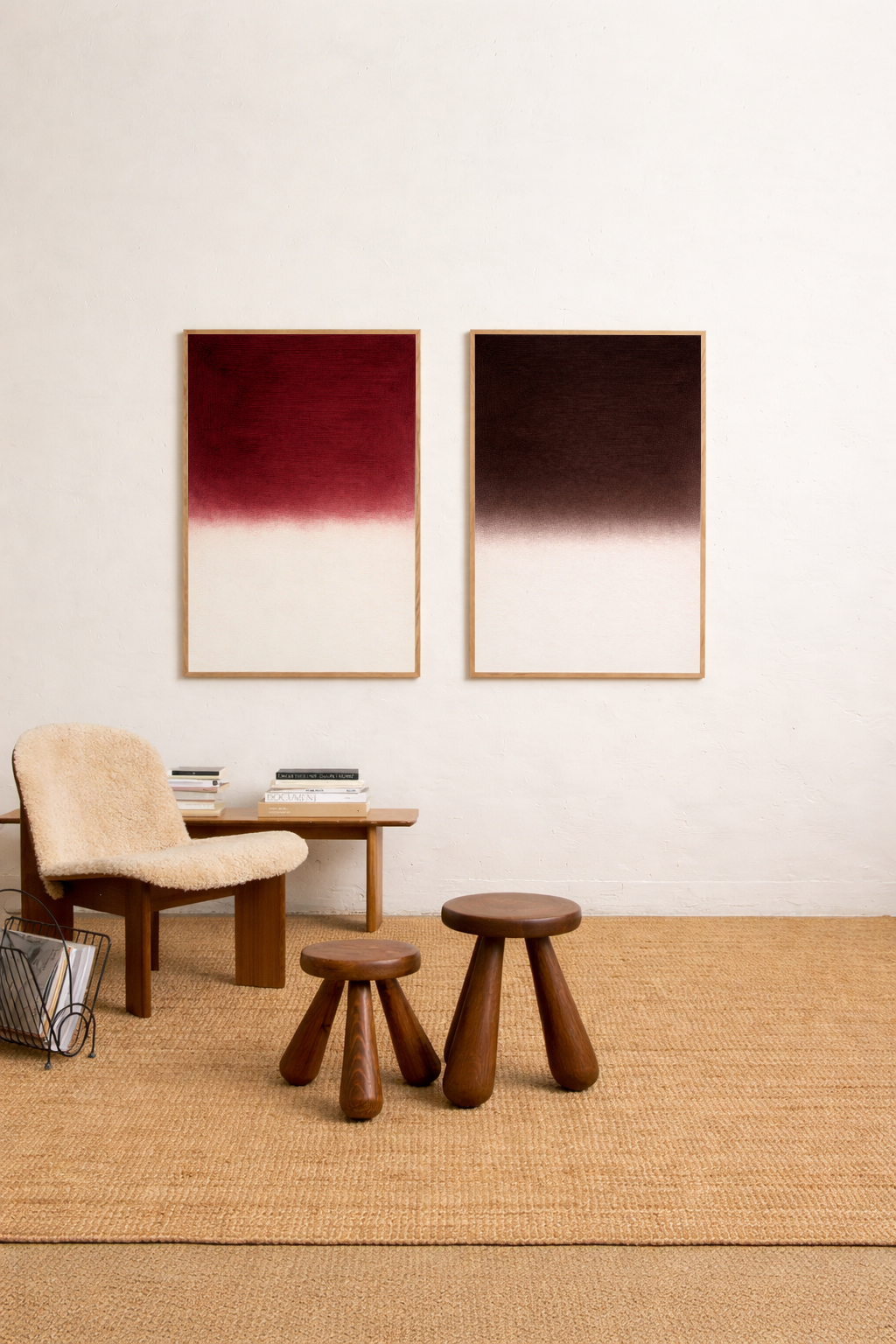 Modern interior with a table, chairs, and two framed artworks on a white wall.