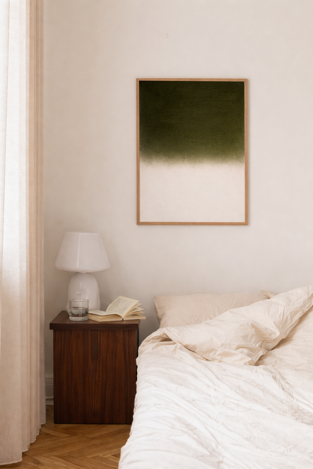 Bedroom with a bed, nightstand, and wall art