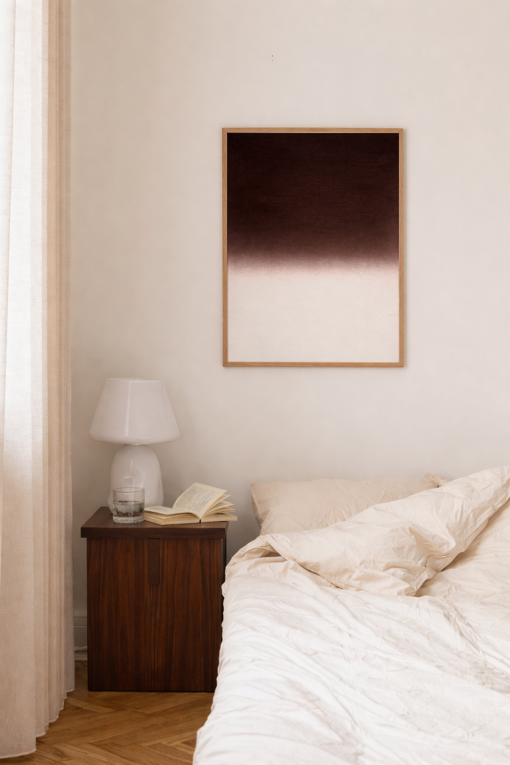 Bedroom with a bed, nightstand, and wall art