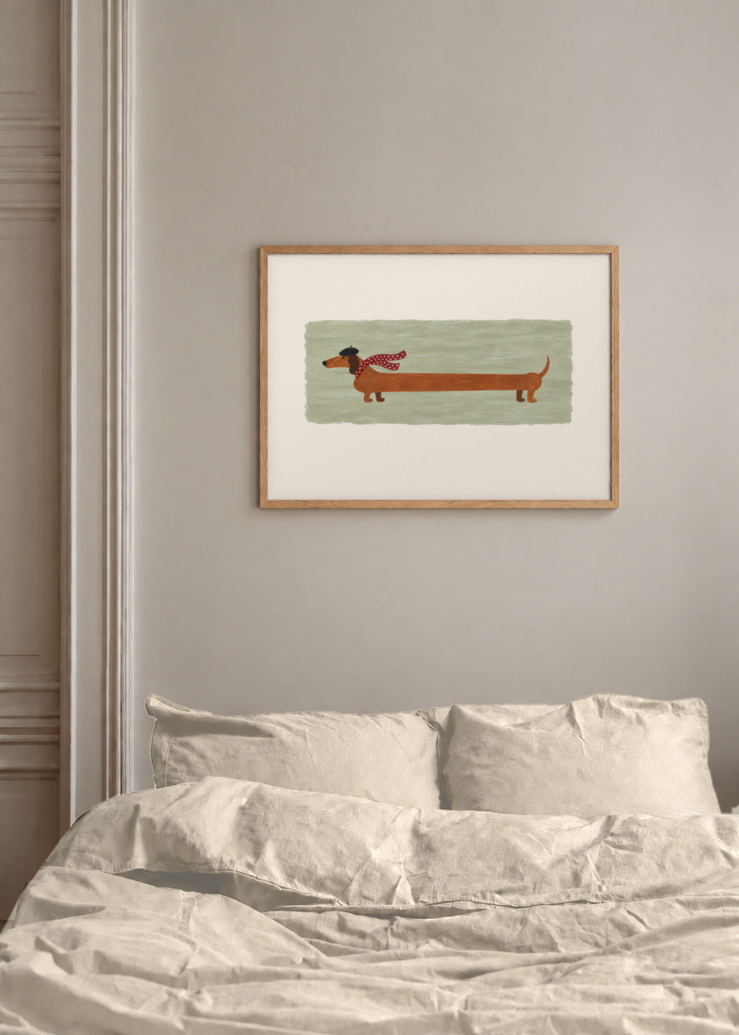 the long walk in sage, framed above a bed with warm linen bedding